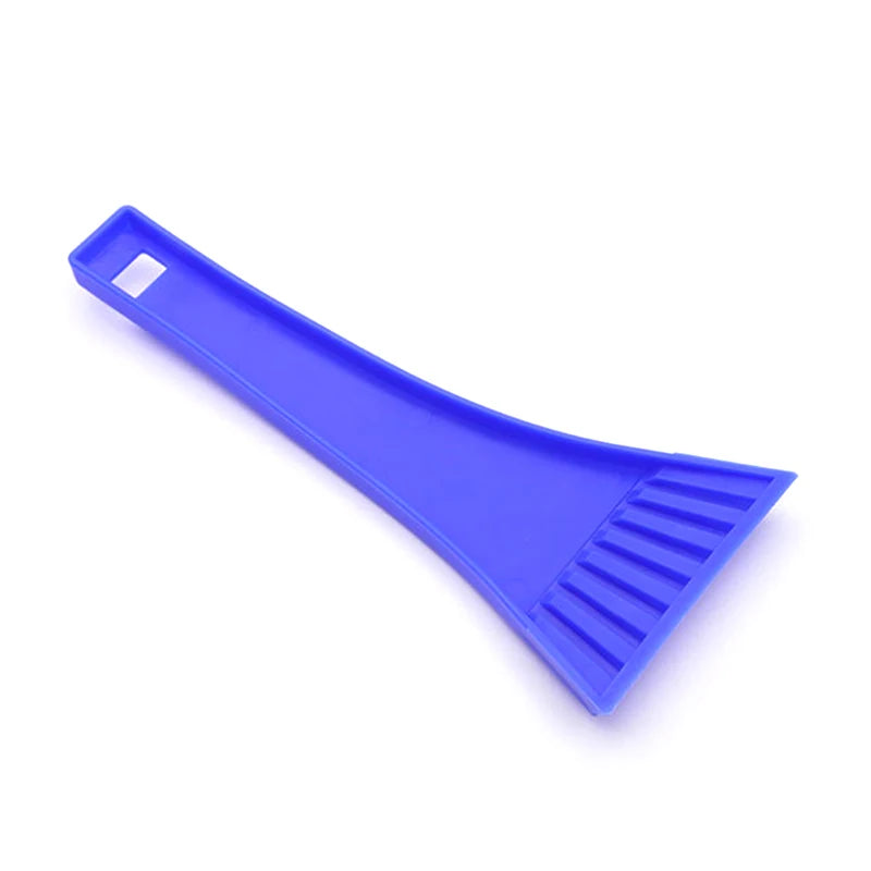 Scraper in use on a windshield