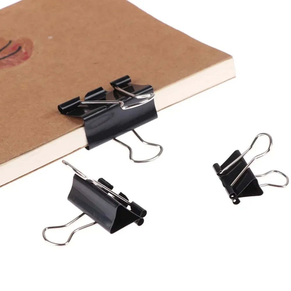 Binder clips holding a document set