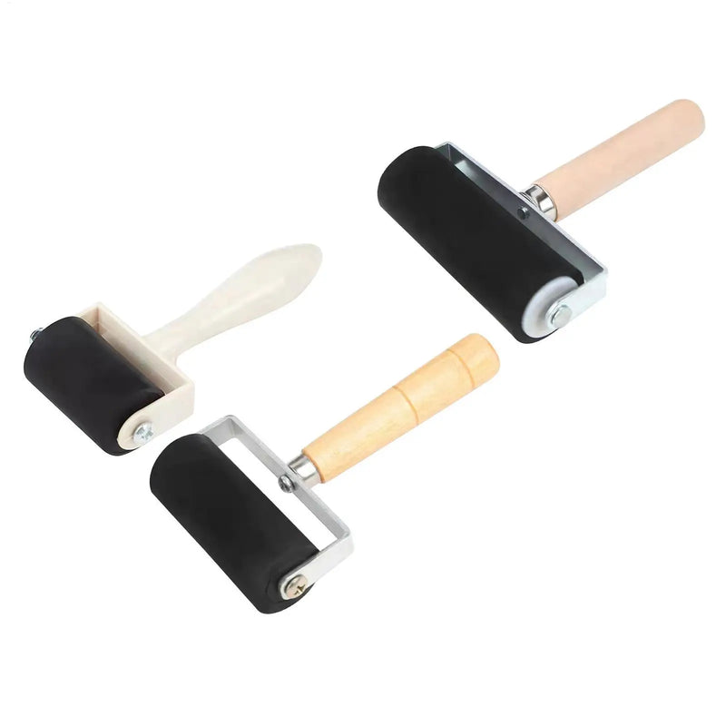 Brayer rolling ink on a slab