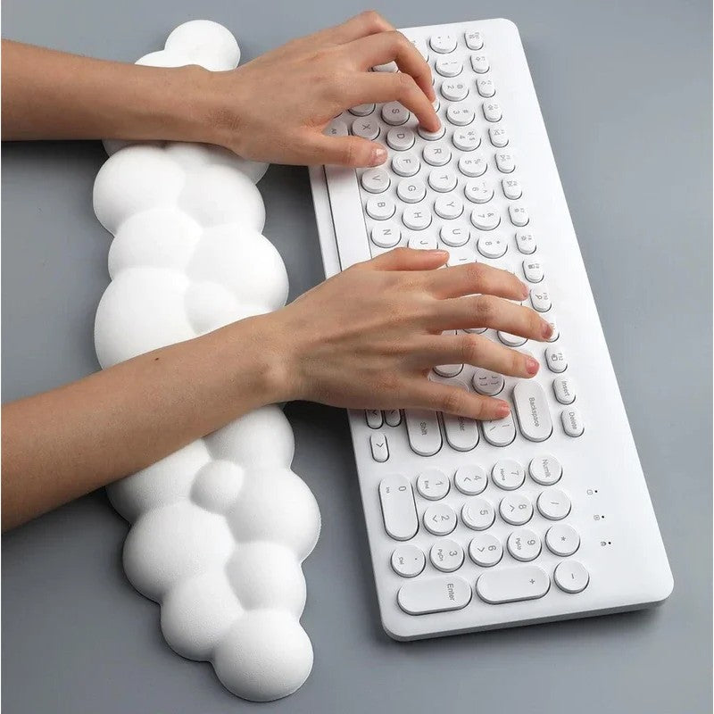 Long cloud wrist rest in front of a keyboard